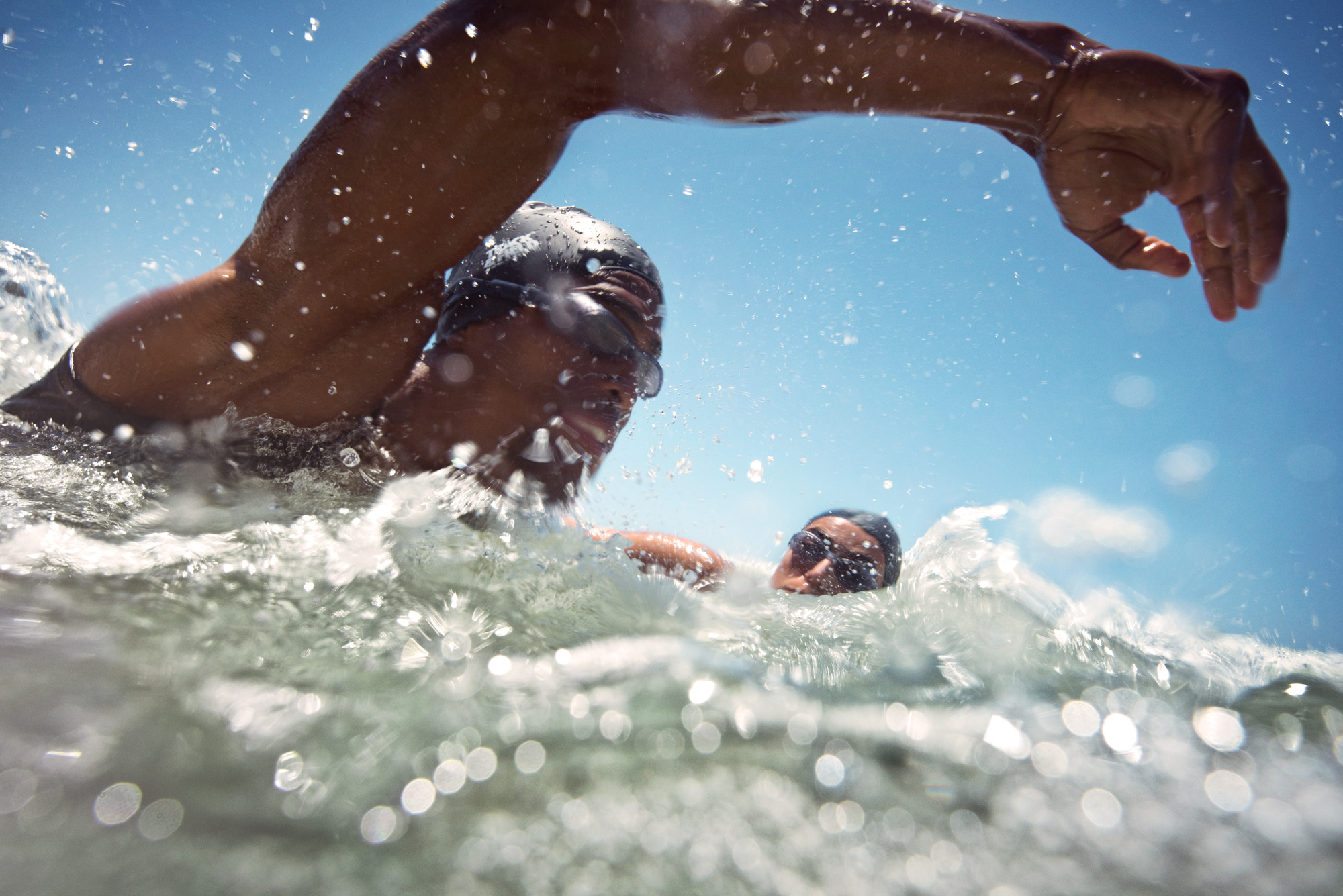 Beach Triathletes_Diving in water_Abbott_2722